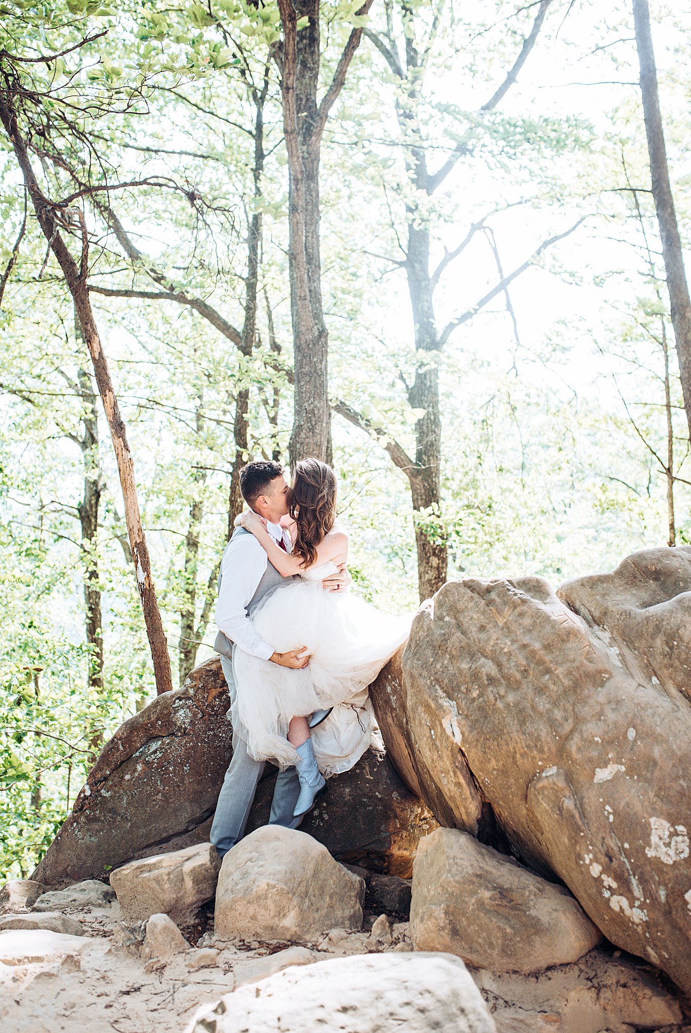 bride and groom hikes natural bridge trail in red river gorge